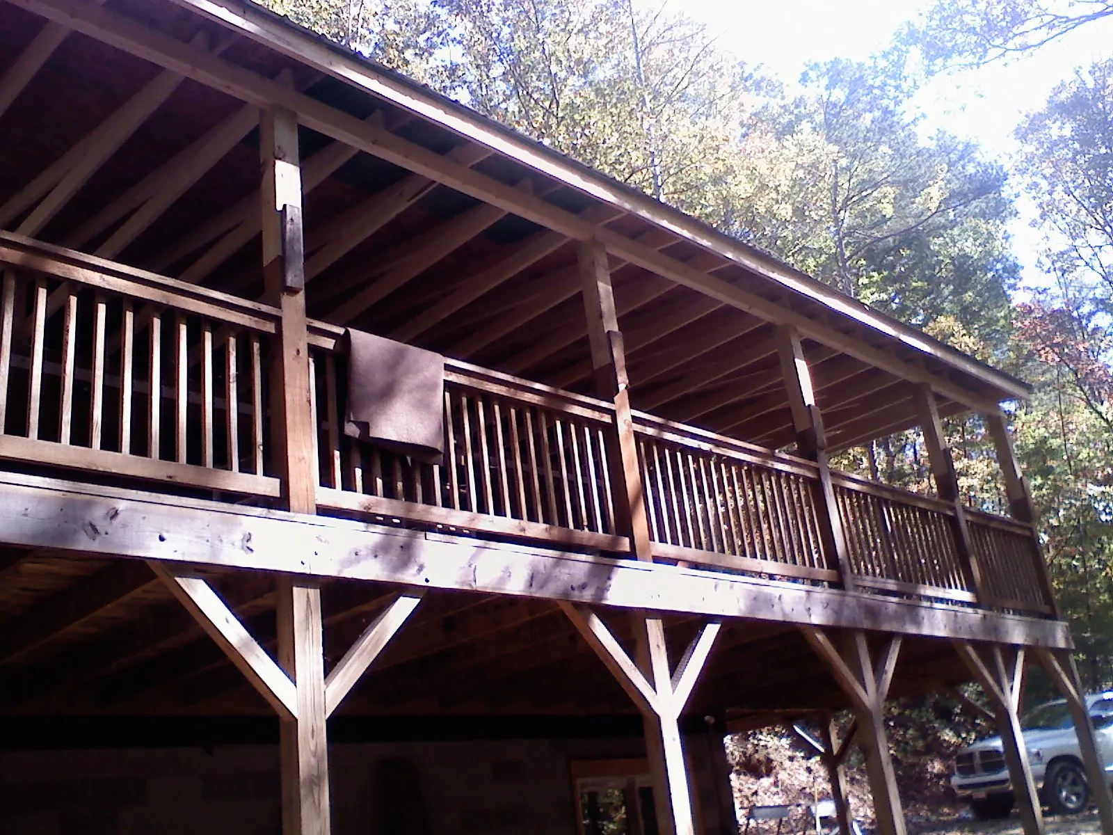 Timber framing under a new elevated porch and deck — Roof Leak Repair in Victor by Roofing Brothers